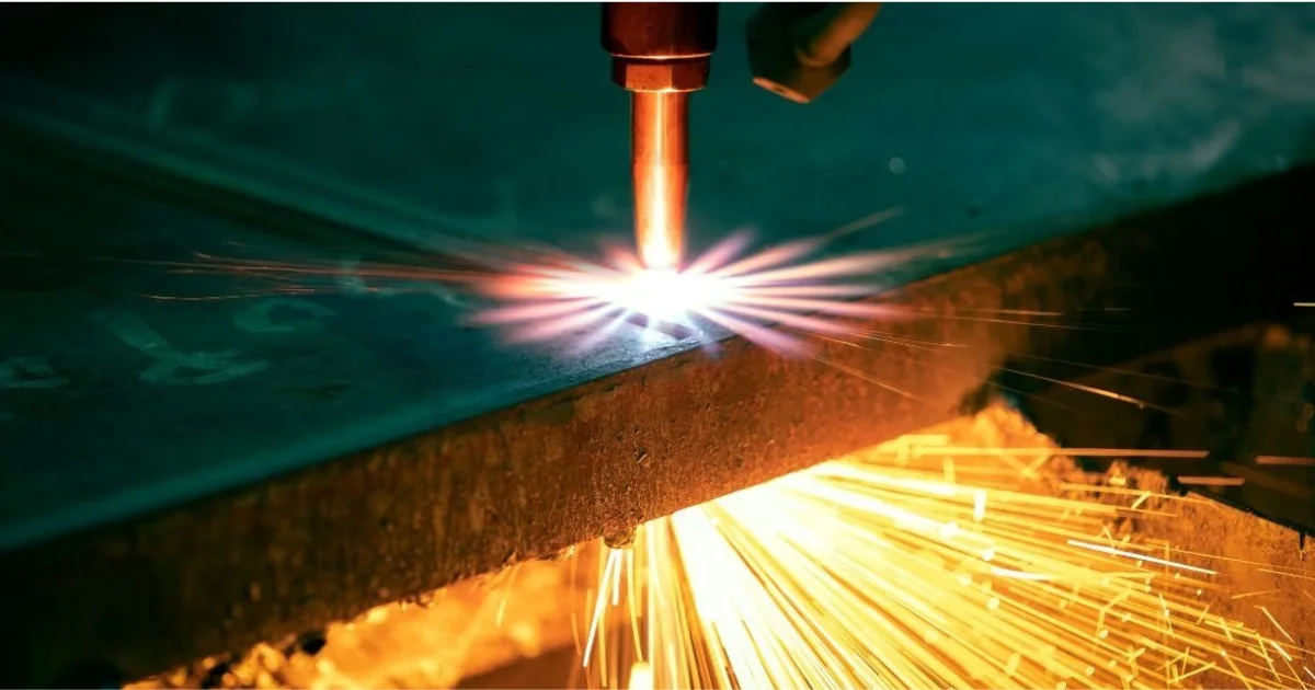 Flame cutting machine actively cutting through a thick metal slab